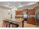 Modern kitchen features stainless steel appliances, granite countertops, a breakfast bar and pendant lighting at 228 Ellisview Dr, Cary, NC 27519