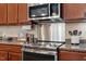 The kitchen features granite countertops, modern stainless steel appliances, and updated cabinetry at 228 Ellisview Dr, Cary, NC 27519
