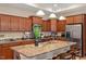 Open kitchen with granite countertops, stainless steel appliances, pendant lighting, and a breakfast bar with seating at 228 Ellisview Dr, Cary, NC 27519