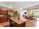 Gourmet kitchen featuring granite countertops, stainless steel appliances, and a breakfast bar at 228 Ellisview Dr, Cary, NC 27519