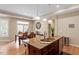 Open kitchen with stainless appliances, granite countertops and breakfast bar located near the dining area at 228 Ellisview Dr, Cary, NC 27519