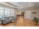 Open living room with hardwood floors, recessed lighting, an open view to the kitchen and a ceiling fan at 228 Ellisview Dr, Cary, NC 27519