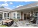 Cozy outdoor patio featuring an outdoor dining and seating area with egg chair at 228 Ellisview Dr, Cary, NC 27519