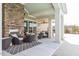 Outdoor patio has ample seating, a stone fireplace, and serene ambiance at 228 Ellisview Dr, Cary, NC 27519