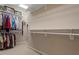 Spacious walk-in closet with ample hanging space and shelving units at 228 Ellisview Dr, Cary, NC 27519
