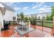 Spacious back deck featuring a dining area and a clear view of the backyard at 2301 Laurel Valley Way, Raleigh, NC 27604