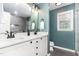 Bathroom features a double sink vanity with modern fixtures, gray shower tile, and updated lighting at 2301 Laurel Valley Way, Raleigh, NC 27604
