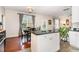 Kitchen island next to hardwood dining table at 2301 Laurel Valley Way, Raleigh, NC 27604