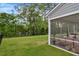 Expansive backyard with lush green lawn and screened porch for outdoor living at 2426 Heron Watch Pl, Fuquay Varina, NC 27526