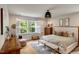 Inviting bedroom with large windows, plantation shutters, stylish decor, and a comfortable bed at 2426 Heron Watch Pl, Fuquay Varina, NC 27526
