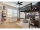 Cozy bedroom with stylish bunk beds, complemented by a window and a ceiling fan at 2426 Heron Watch Pl, Fuquay Varina, NC 27526