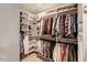 Spacious walk-in closet with ample shelving, hanging space, and organized storage solutions at 2426 Heron Watch Pl, Fuquay Varina, NC 27526