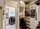 Organized walk-in closet with built-in shelving, laundry area, and ample storage space at 2426 Heron Watch Pl, Fuquay Varina, NC 27526