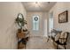 Bright entryway with console table, stylish mirror, and wood bench at 2426 Heron Watch Pl, Fuquay Varina, NC 27526
