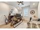 Bright and spacious home office with modern desk and plenty of natural light at 2426 Heron Watch Pl, Fuquay Varina, NC 27526