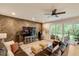 Cozy living room with herringbone accent wall, fireplace, and plush seating at 2426 Heron Watch Pl, Fuquay Varina, NC 27526