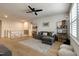 Spacious living room with modern decor, comfortable seating, and hardwood floors at 2426 Heron Watch Pl, Fuquay Varina, NC 27526