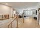 Upstairs loft with hardwood floors, a cozy seating area, and an abundance of natural light at 2426 Heron Watch Pl, Fuquay Varina, NC 27526