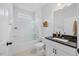 Clean bathroom with a shower-tub combo, a large vanity, and great lighting at 247 Axis Deer Ln, Garner, NC 27529
