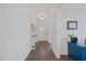 Bright entryway featuring hardwood floors, white wainscoting, and stylish decor at 247 Axis Deer Ln, Garner, NC 27529