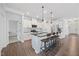 Modern kitchen with a large island, stainless steel appliances, and pendant lighting at 247 Axis Deer Ln, Garner, NC 27529