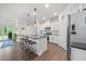 Bright, open kitchen with a large island, stainless steel appliances, and modern finishes at 247 Axis Deer Ln, Garner, NC 27529