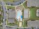 Birds eye view of community amenities including a large pool, playground, basketball court, and ample parking at 260 Amber Acorn Ave, Raleigh, NC 27603