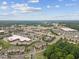 Scenic aerial shot featuring nearby shopping centers, dining, and other townhome communities in the distance at 260 Amber Acorn Ave, Raleigh, NC 27603