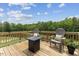 Outdoor deck space featuring wood floors, a table and outdoor seating at 260 Amber Acorn Ave, Raleigh, NC 27603