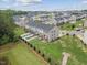 Aerial view of the back of townhomes with private decks, fenced yards, and manicured lawns at 260 Amber Acorn Ave, Raleigh, NC 27603