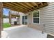 View of the outdoor patio with an adjacent green lawn area perfect for relaxation or entertainment at 260 Amber Acorn Ave, Raleigh, NC 27603