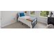 Cozy bedroom with natural light, a twin bed and neutral-colored furniture at 260 Amber Acorn Ave, Raleigh, NC 27603