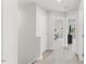 Hallway leading to bedrooms, featuring neutral paint and carpet at 260 Amber Acorn Ave, Raleigh, NC 27603