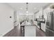 Modern kitchen boasts stainless steel appliances, a large island, and ample cabinet space at 260 Amber Acorn Ave, Raleigh, NC 27603