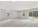 Spacious living room with carpet, recessed lighting and sliding glass doors leading to outdoor area at 260 Amber Acorn Ave, Raleigh, NC 27603