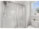Shower stall featuring a glass door, tiled walls, and showerhead at 260 Amber Acorn Ave, Raleigh, NC 27603