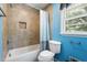 Tiled bathroom with a shower over tub and an alcove for storage at 28 White Oak Dr, Smithfield, NC 27577