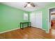 This bedroom features hardwood floors, a ceiling fan, a closet and natural light at 28 White Oak Dr, Smithfield, NC 27577