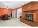 Spacious living room with a brick fireplace and views into the dining room at 28 White Oak Dr, Smithfield, NC 27577