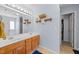 Well-lit bathroom with double sinks and a walk-in shower at 2950 Settle In Ln, Raleigh, NC 27614