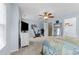 Light-filled bedroom featuring a ceiling fan and plush carpeting at 2950 Settle In Ln, Raleigh, NC 27614