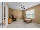 Bedroom featuring plush carpeting, a ceiling fan, and a sunlit window with a window seat at 2950 Settle In Ln, Raleigh, NC 27614