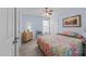 Cozy bedroom featuring neutral carpet, ceiling fan, and colorful bedding at 2950 Settle In Ln, Raleigh, NC 27614