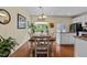Dining room featuring hardwood floors, a wooden table, and ample natural light at 2950 Settle In Ln, Raleigh, NC 27614