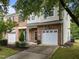 Attractive brick and siding townhome with a covered entryway and a well-kept front yard at 2950 Settle In Ln, Raleigh, NC 27614