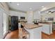 Kitchen with granite countertops, stainless steel appliances, and hardwood floors at 2950 Settle In Ln, Raleigh, NC 27614
