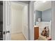 Bathroom and walk-in closet with neutral wall colors and tile flooring at 300 Gilman Ln # 101, Raleigh, NC 27610