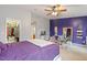 Bedroom featuring a ceiling fan and a spacious walk-in closet for storage at 300 Gilman Ln # 101, Raleigh, NC 27610