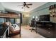 Bedroom with a bunk bed, accent wall, and comfortable chair at 300 Gilman Ln # 101, Raleigh, NC 27610
