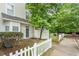 Attractive townhome exterior showcasing a well-maintained yard and inviting front entry at 300 Gilman Ln # 101, Raleigh, NC 27610